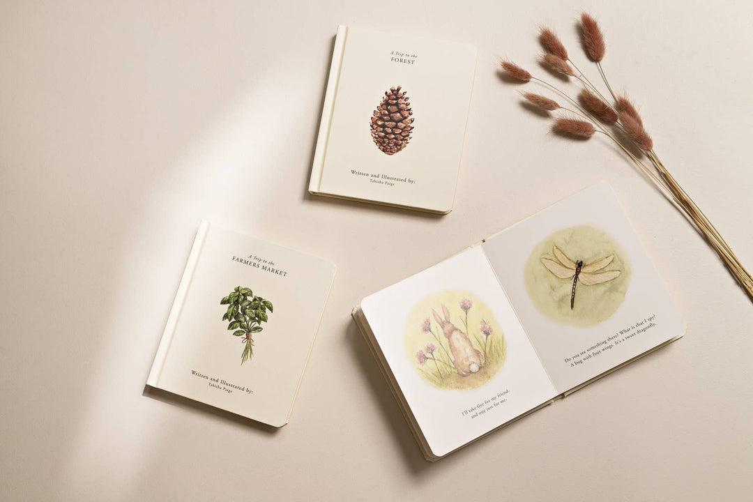 Our Little Adventures board books with an open forest story spread featuring watercolor rabbit and dragonfly illustrations