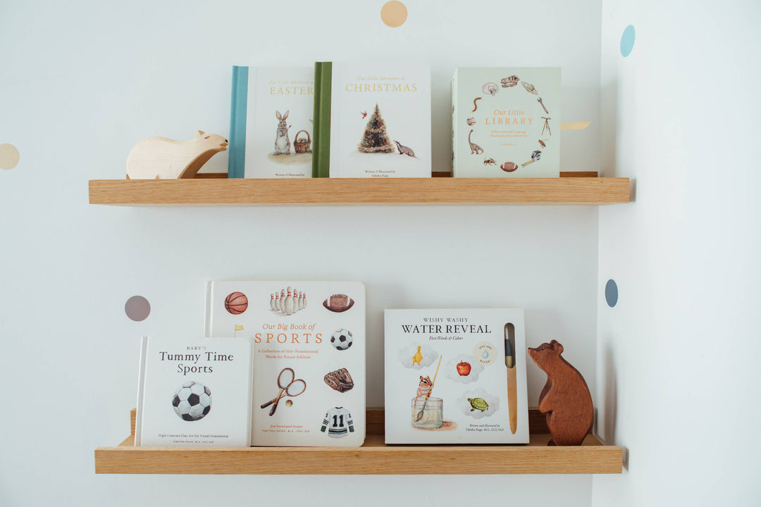 Our Little Library Vol. 3 displayed on nursery bookshelves with other illustrated children&