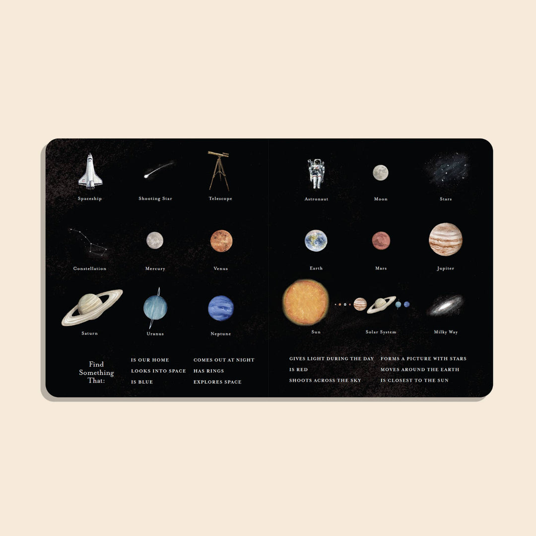 Our Little Library Vol. 3 Space board book open to an illustrated spread of space objects, planets, and vocabulary