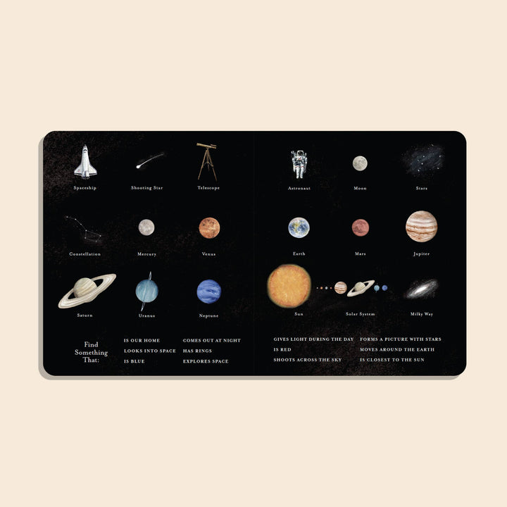 Our Little Library Vol. 3 Space board book open to an illustrated spread of space objects, planets, and vocabulary