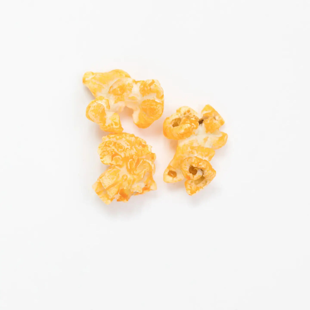 Close-up of cheesy Pimento Cheese Hand-Crafted Popcorn pieces