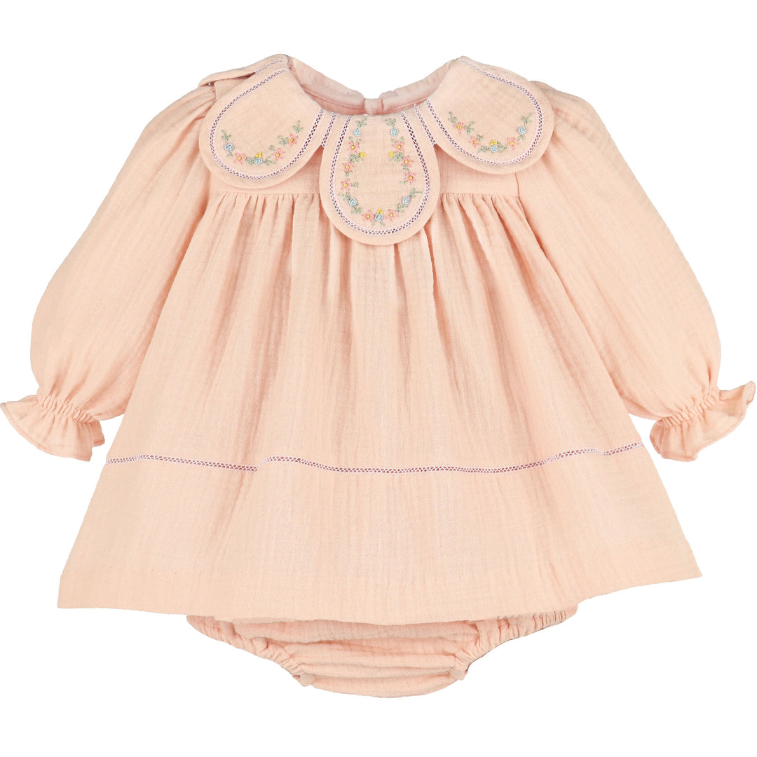 Front view of Pink Cuddle Cotton Petal Float with embroidered floral petal collar, long puff sleeves, ruffle cuffs, and matching bloomers.