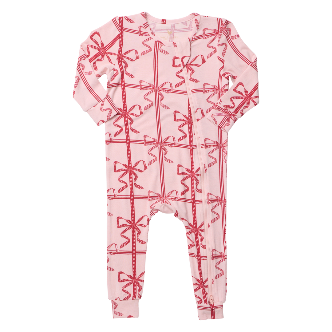 Flat image of the front of Pink Chicken's Baby Bamboo Romper in the print 'Pink Present Bow'. 