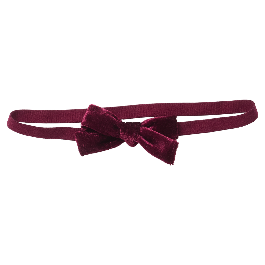 Flat image of Pink Chicken's Baby Bow Stretchy Headband In Burgundy Velour with no background. 