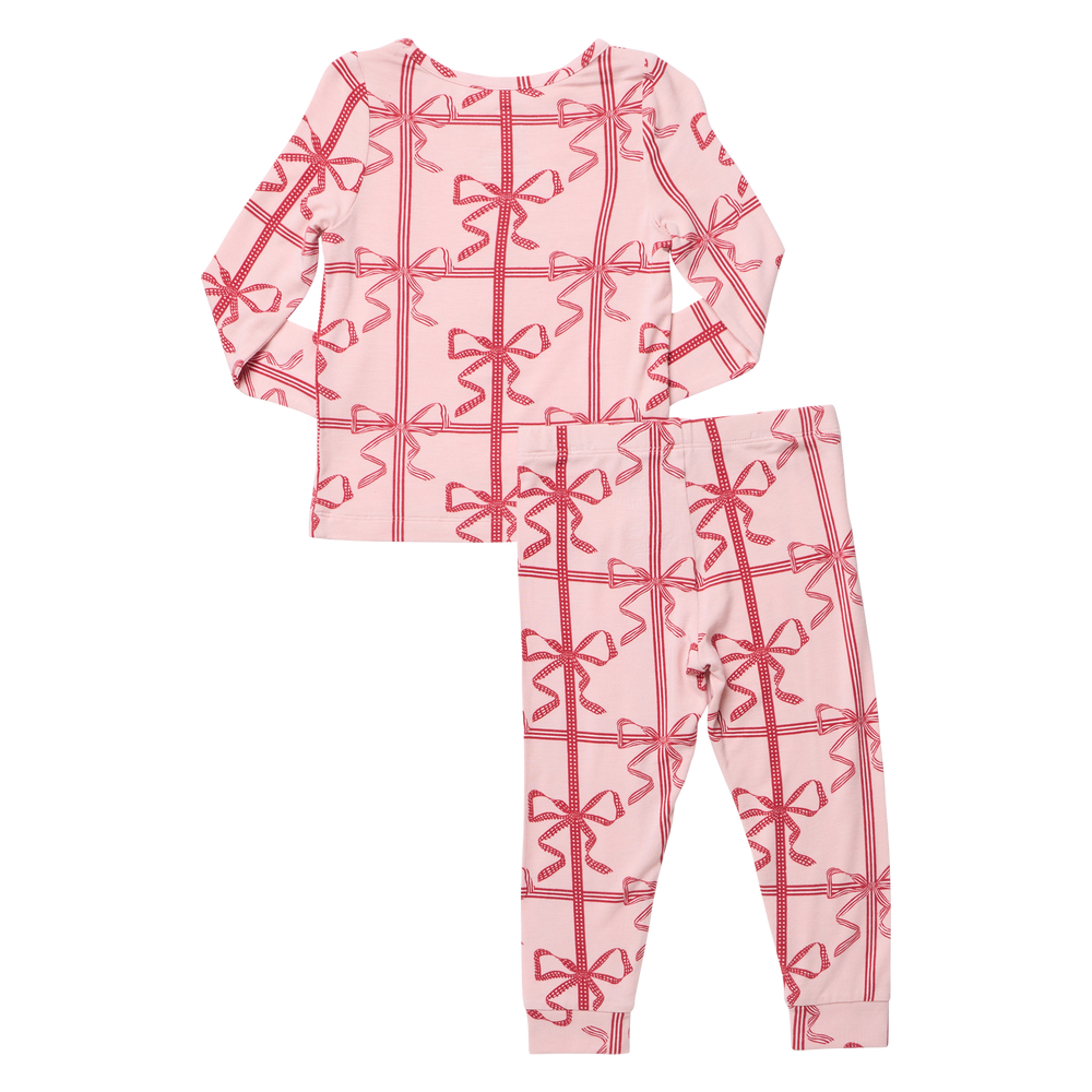 Flat image of the back of Pink Chicken's Kid's Bamboo PJ Set in their new print 'Pink Present Bows'.