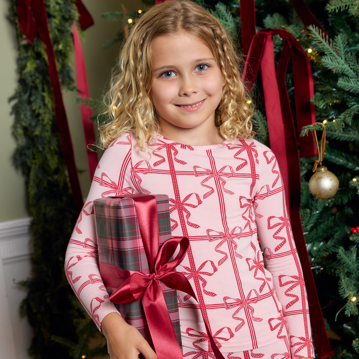 Lifestyle image of a little girl wearing Pink Chicken&