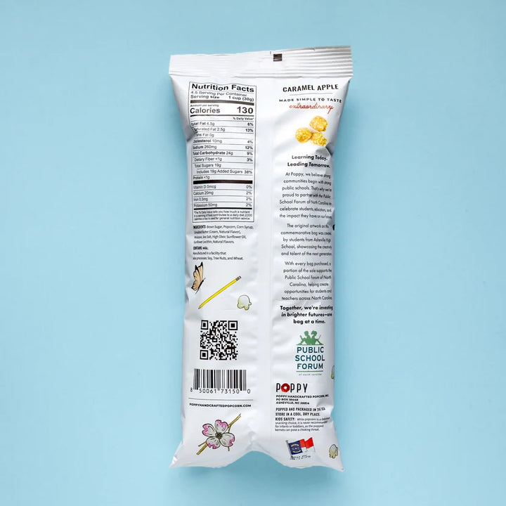 Back of Poppy Caramel Apple Hand-Crafted Popcorn 5 oz bag displaying nutrition facts, ingredients, and public school education initiative.