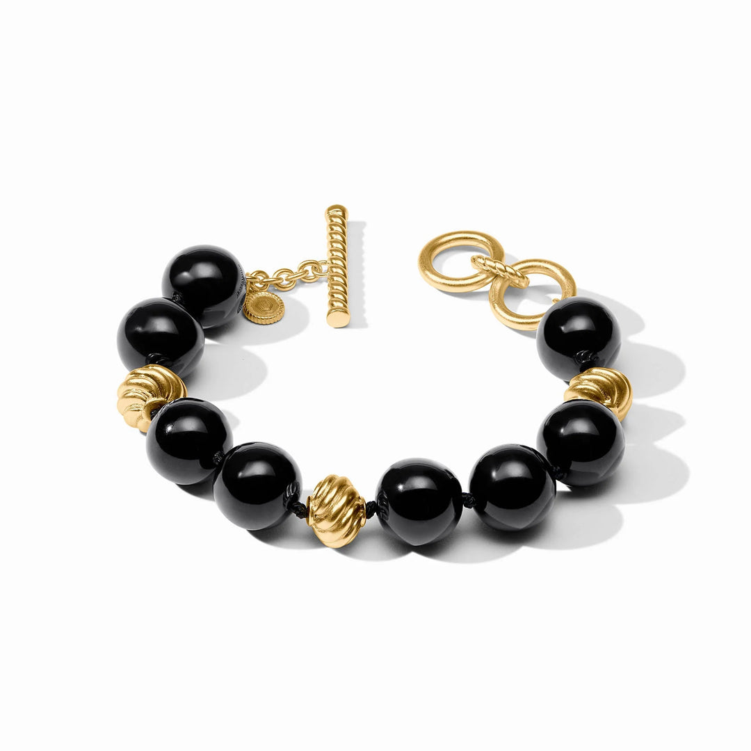 Ravello Bracelet in obsidian black with glossy round cabochons, sculpted gold accents, and toggle closure
