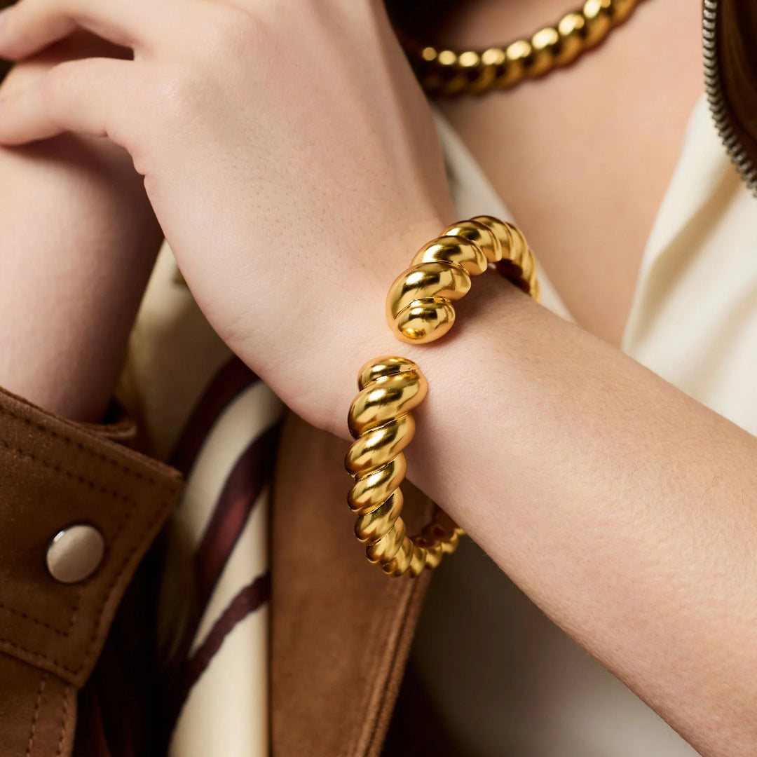 Model wearing gold Ravello Cuff bracelet
