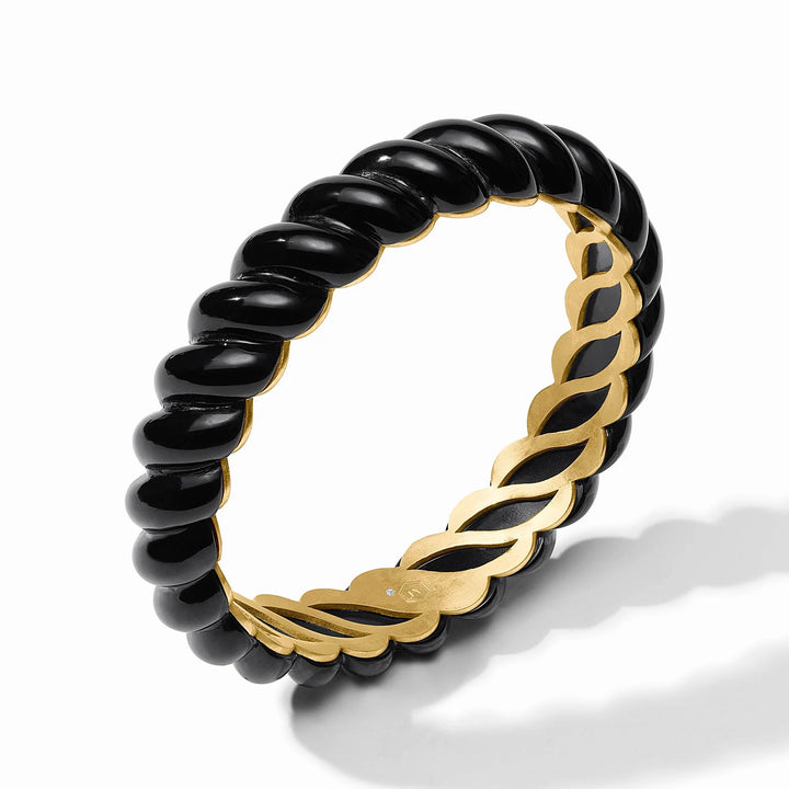 Angled detail view of Ravello Statement Bangle in obsidian black with sculpted twist design