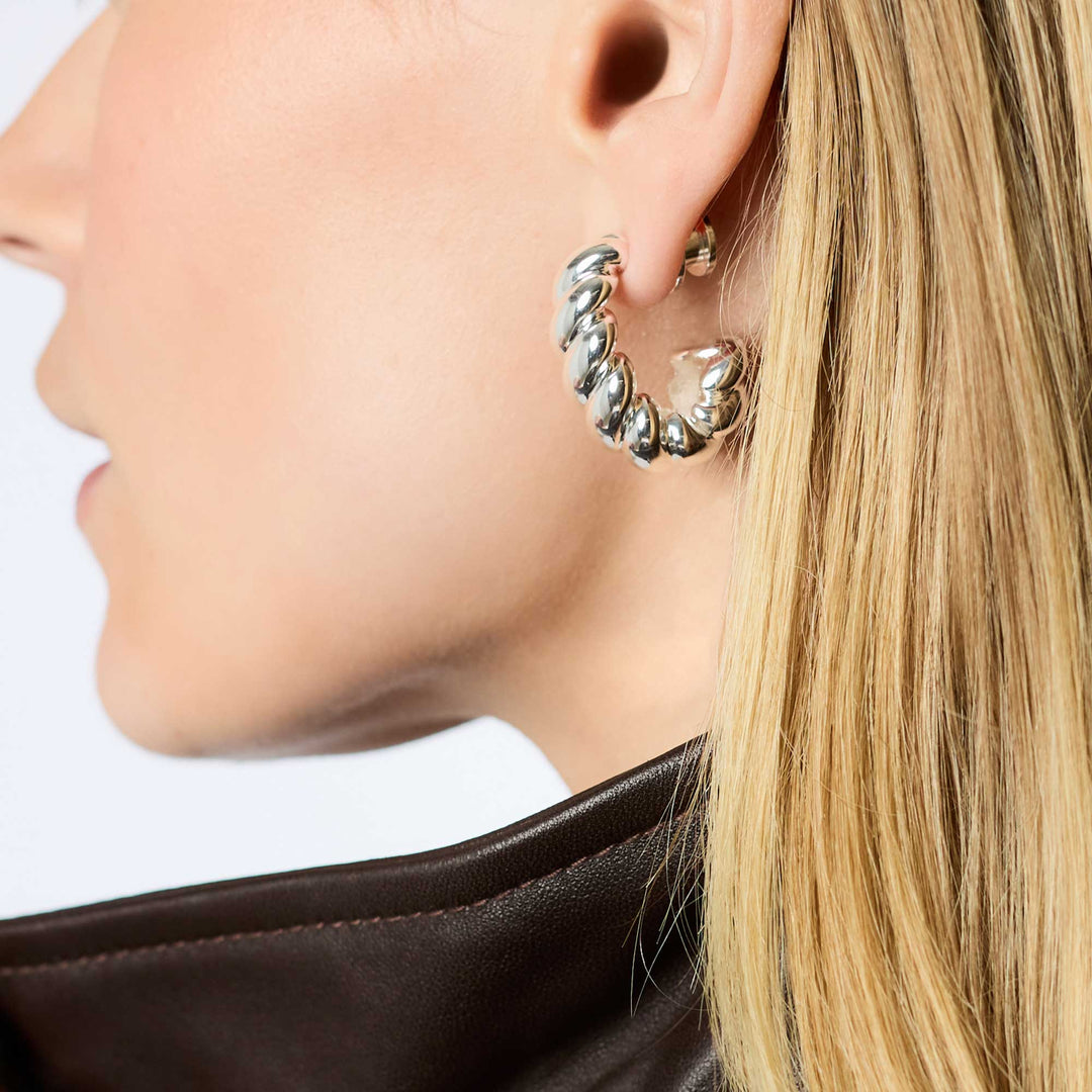 Model wearing silver Ravello Statement Hoop earring