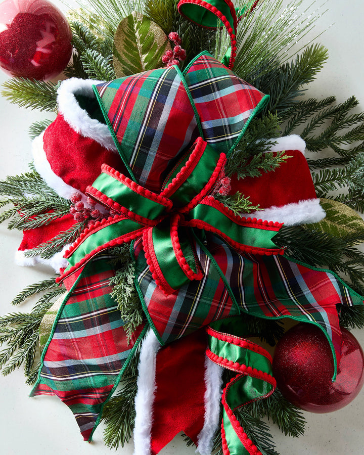 Classic Christmas tartan plaid wired ribbon featuring a traditional festive pattern, perfect for decorating wreaths, Christmas trees, garlands, bows, and holiday arrangements. The timeless red and green plaid design adds cozy Christmas charm to farmhouse, traditional, and rustic holiday décor.