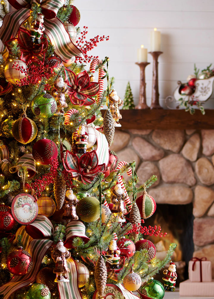 Green Christmas ribbon with a delicate gold edge woven throughout a decorated Christmas tree, adding elegant green and gold accents to the holiday tree.