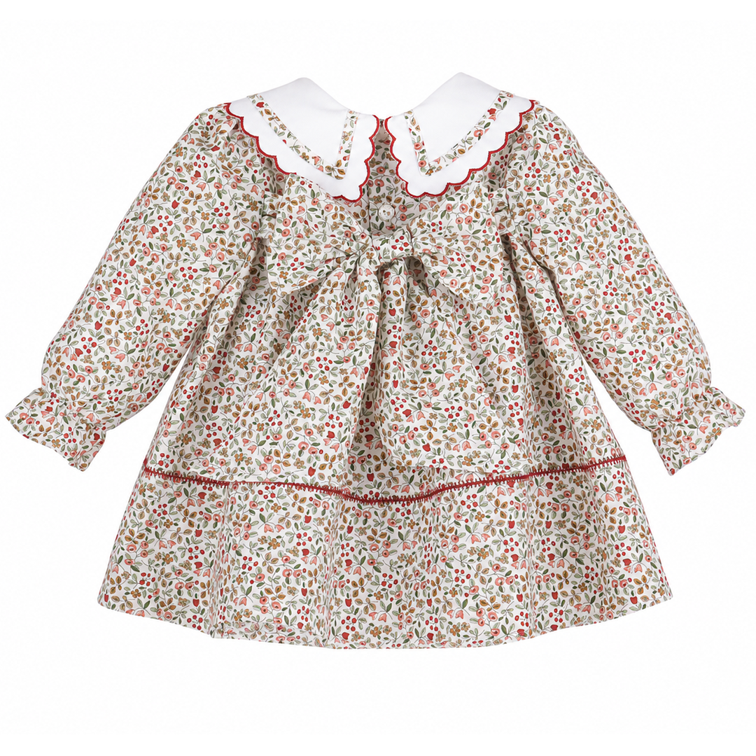Back view of Red Claret Berries &amp; Blooms baby girl dress featuring a floral berry print, white scalloped collar, red trim, long sleeves, and back bow.