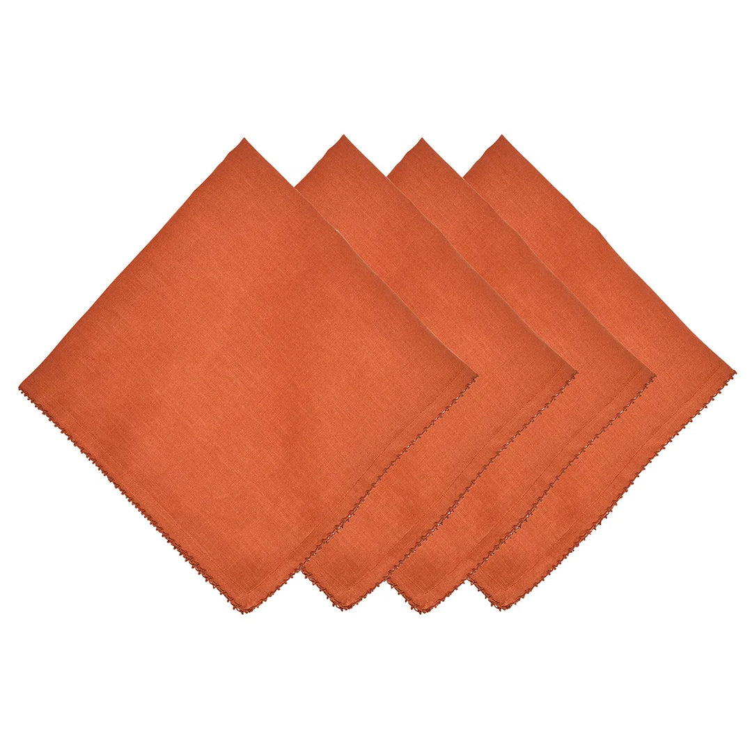 Set of four rust terracotta linen dinner napkins with decorative stitched edging