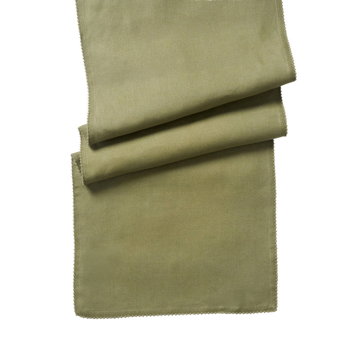 Sage green table runner folded to showcase its woven linen-look texture and delicate tonal crochet edging