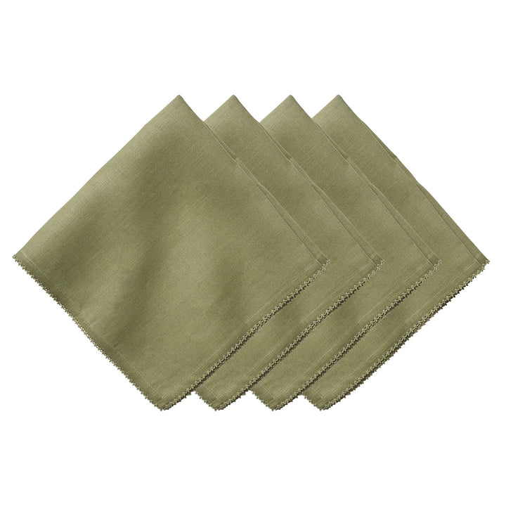 Set of four sage green linen napkins featuring delicate tonal crochet edging for an elegant table setting