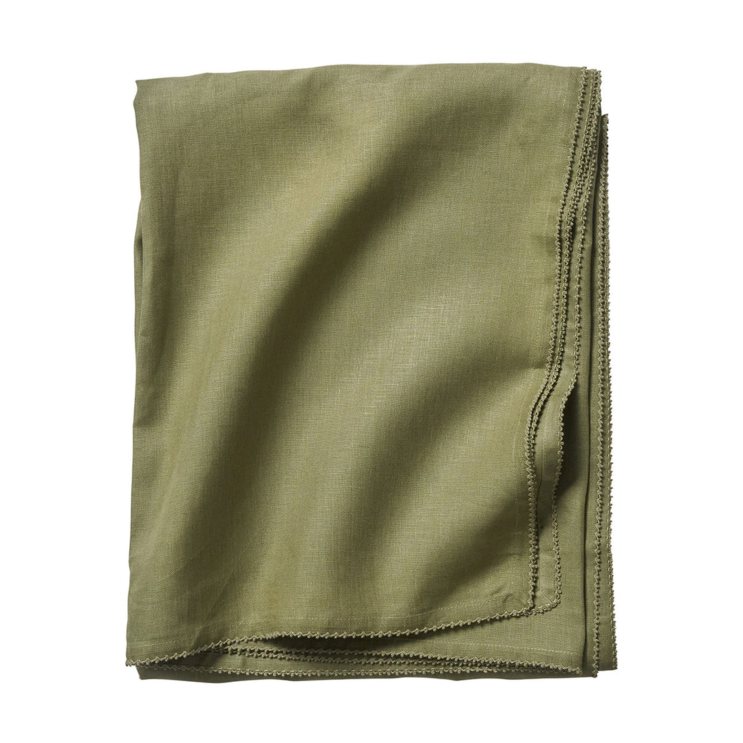 Folded sage green linen tablecloth featuring a delicate tonal crochet edge and softly textured woven finish