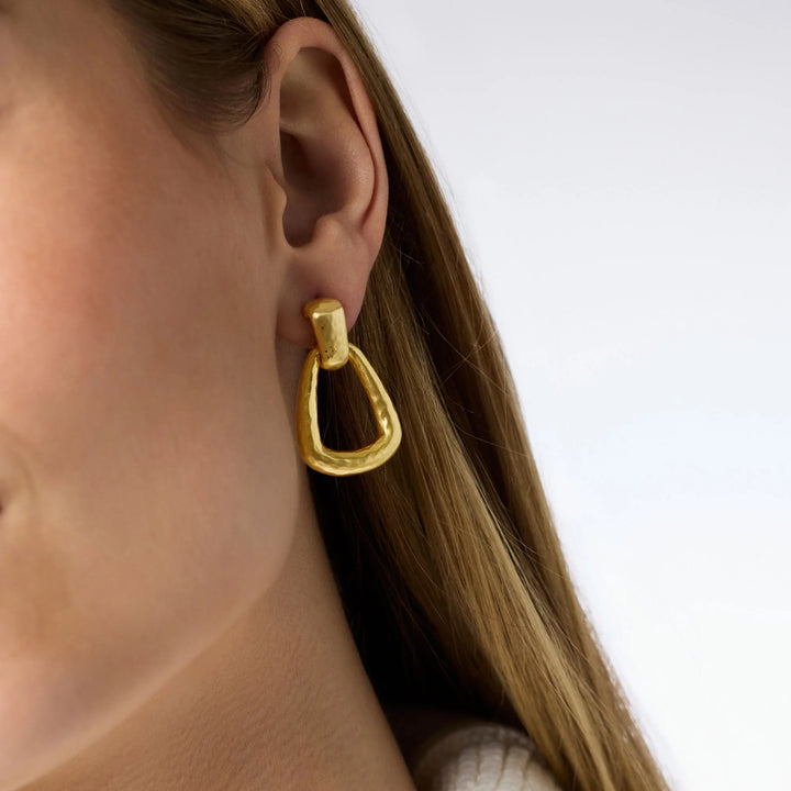 Model wearing the Sahara Demi Doorknocker Earring in gold