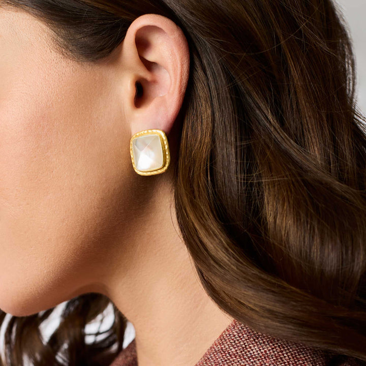 Model wearing Sahara Stone Stud Earrings in iridescent clear crystal