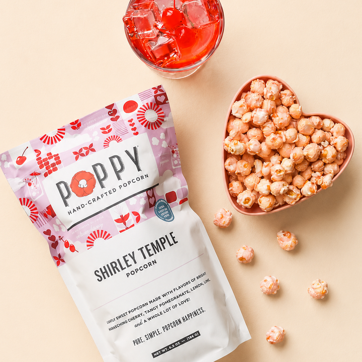 Poppy Shirley Temple Popcorn with pink popcorn in a heart-shaped bowl