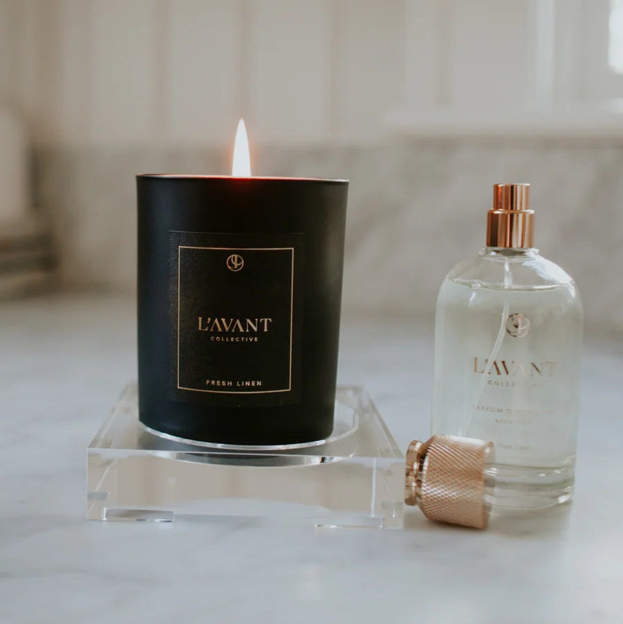 Small clear lucite tray styled with a black candle and perfume bottle for an elegant vanity, dresser, or countertop display.