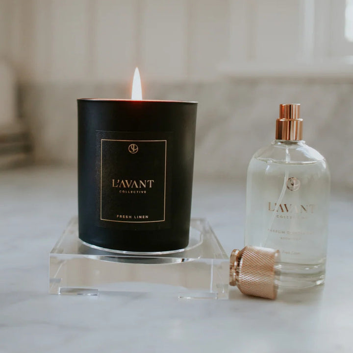Small clear lucite tray styled with a black candle and perfume bottle for an elegant vanity, dresser, or countertop display.