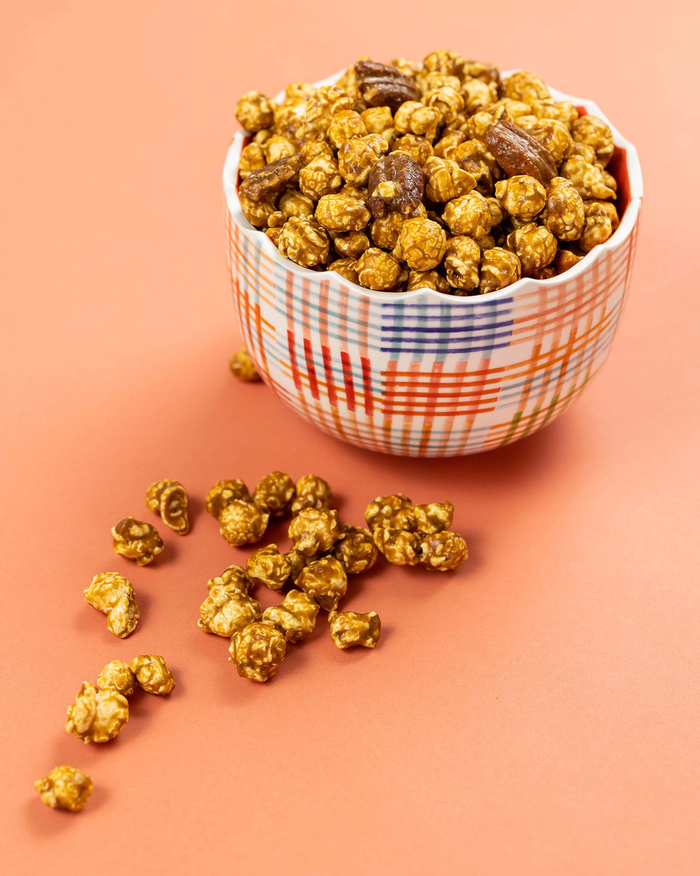 Southern Pecan Pie popcorn and pecans served in a colorful bowl