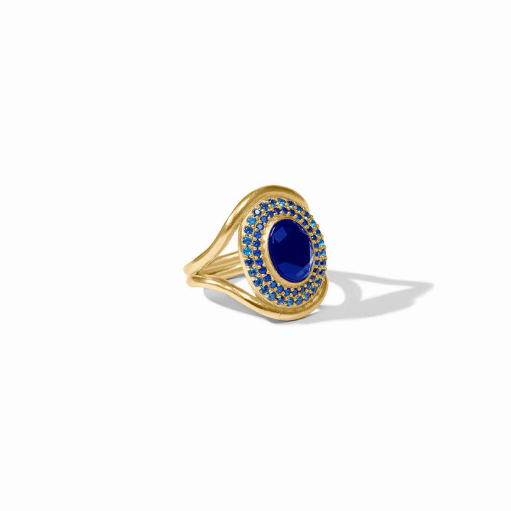 Stardust Statement Ring with sapphire blue center stone and coordinating blue crystals in gold-tone setting