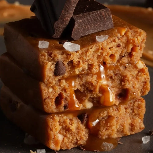 Stars + Honey Cacao Salt Caramel Peanut collagen protein bar broken open to show texture