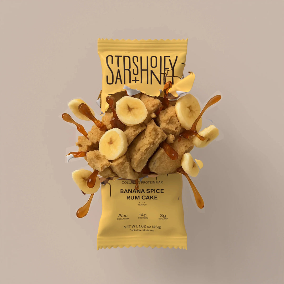 Stars + Honey Banana Spice Rum Cake protein bar styled with banana pieces and warm spices