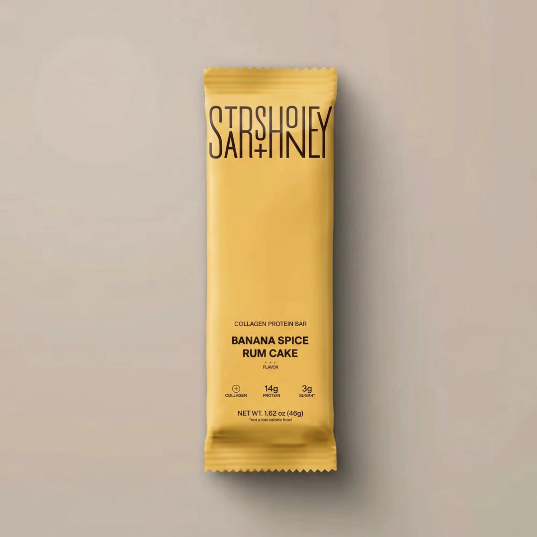 Stars + Honey Banana Spice Rum Cake collagen protein bar in yellow wrapper