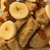 Close-up of Stars + Honey Banana Spice Rum Cake collagen protein bar with banana pieces and warm spices