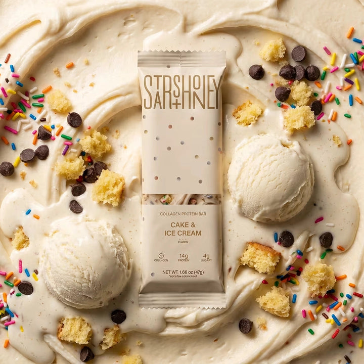 Stars + Honey Cake &amp; Ice Cream collagen protein bar served with scoops of ice cream, chocolate, and rainbow sprinkles