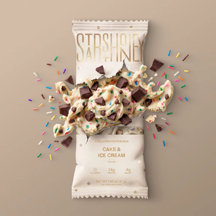 Stars + Honey Cake &amp; Ice Cream collagen protein bar with cake pieces, chocolate chunks, and rainbow sprinkles