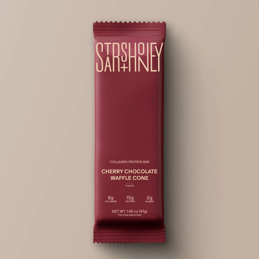 Stars + Honey Cherry Chocolate Waffle Cone collagen protein bar in red wrapper