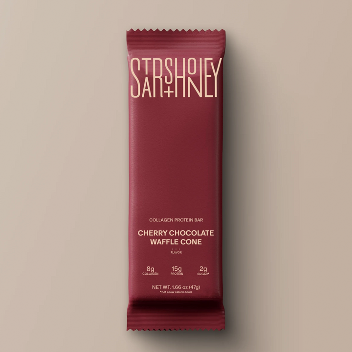 Stars + Honey Cherry Chocolate Waffle Cone collagen protein bar in red wrapper