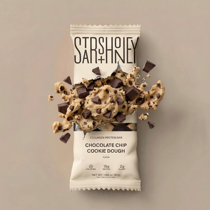 Stars + Honey Chocolate Chip Cookie Dough protein bar styled with cookie dough and chocolate chunks explosion