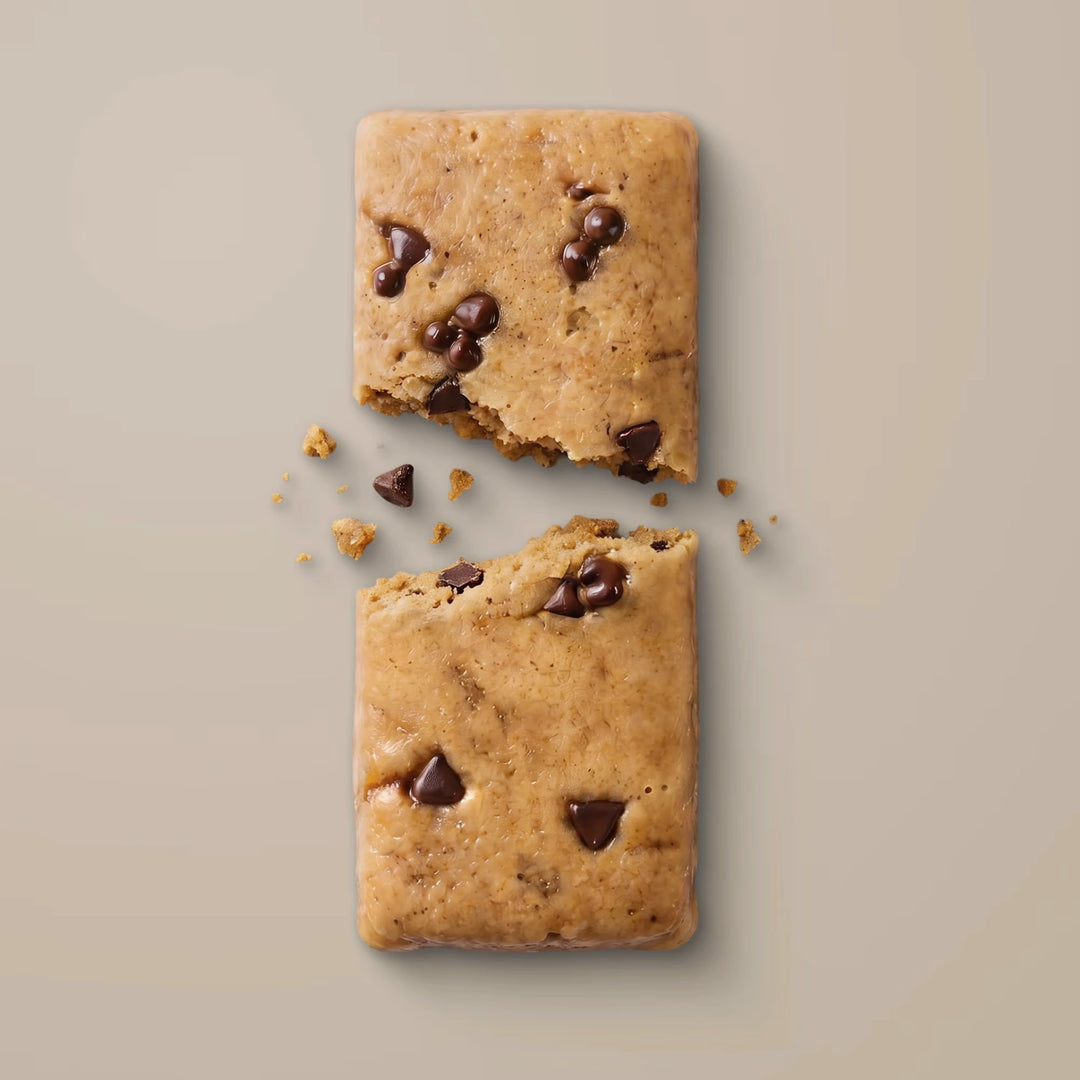 Close-up of Stars + Honey Chocolate Chip Cookie Dough collagen protein bar pieces with chocolate chunks