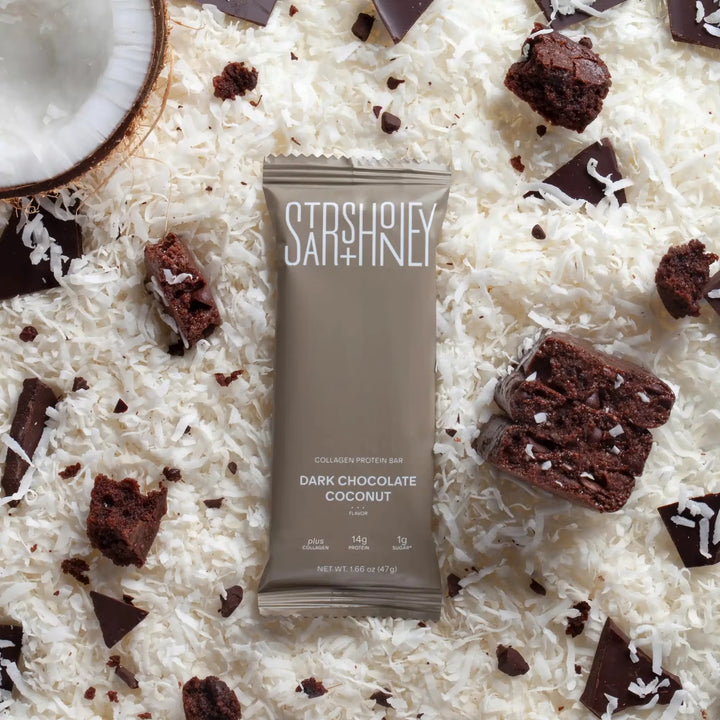 Stars + Honey Dark Chocolate Coconut protein bar styled with coconut flakes and dark chocolate pieces