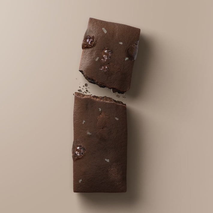 Close-up of Stars + Honey Dark Chocolate Coconut collagen protein bar pieces