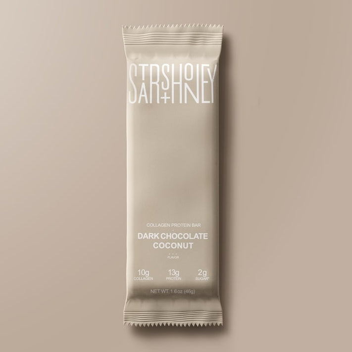 Stars + Honey Dark Chocolate Coconut collagen protein bar in white wrapper