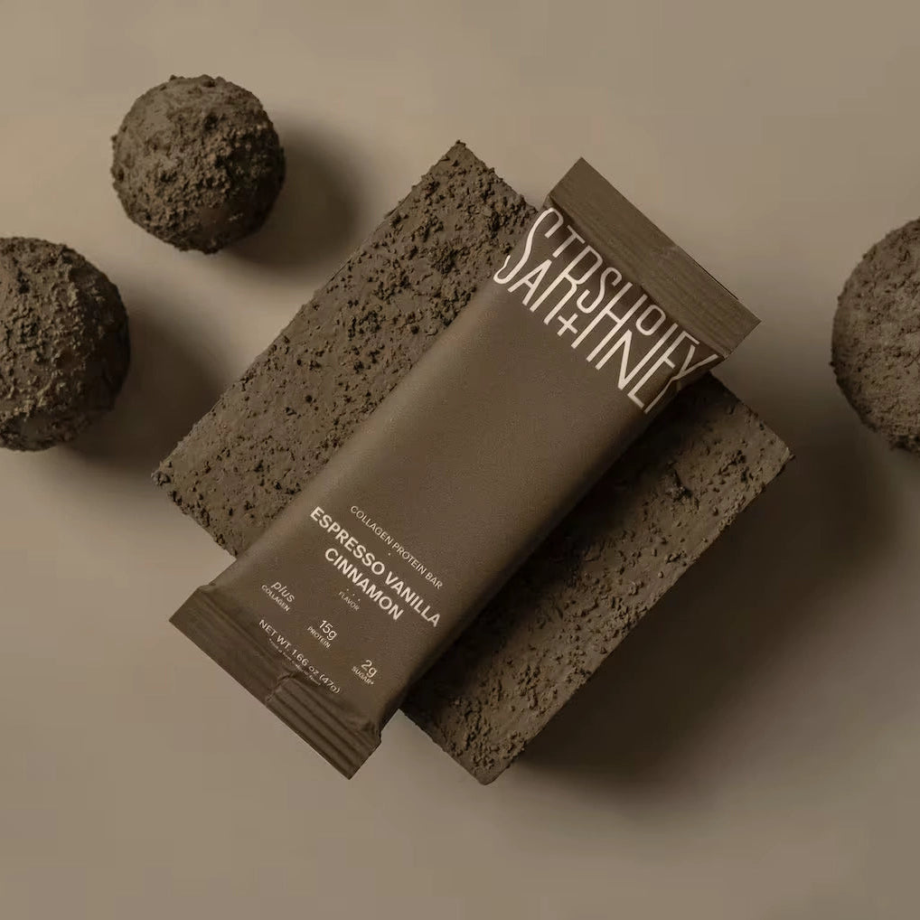Stars + Honey Espresso Vanilla Cinnamon collagen protein bar styled on a neutral background