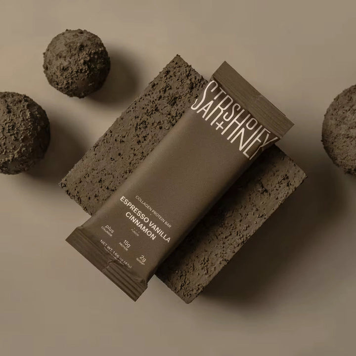 Stars + Honey Espresso Vanilla Cinnamon collagen protein bar styled on a neutral background