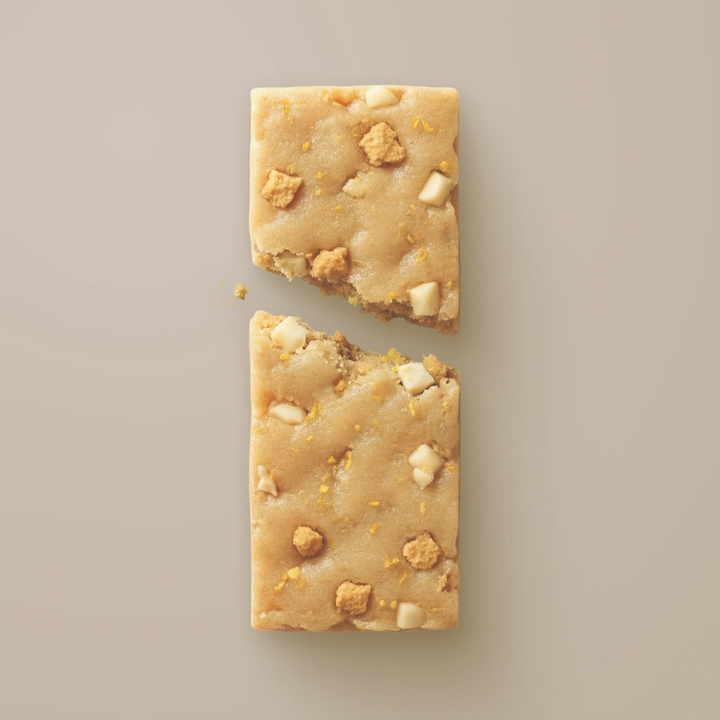 Close-up of Stars + Honey Iced Lemon Cookie collagen protein bar texture and cookie pieces