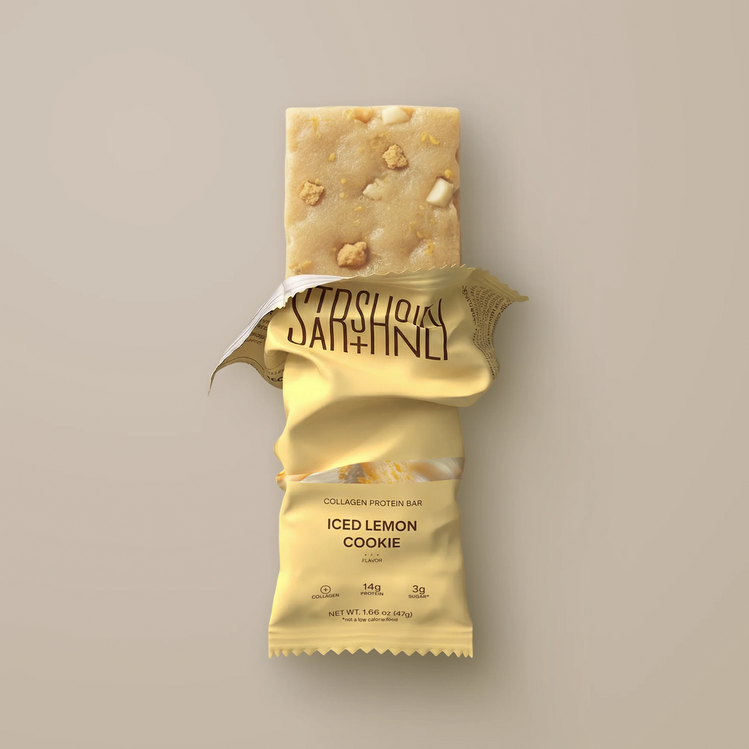 Stars + Honey Iced Lemon Cookie collagen protein bar shown inside open wrapper