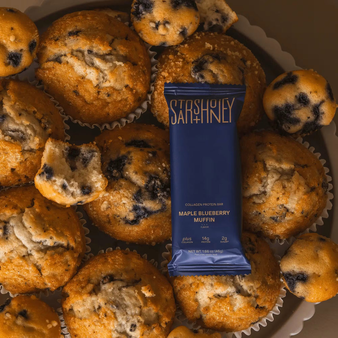 Stars + Honey Maple Blueberry Muffin protein bar styled with blueberry muffins