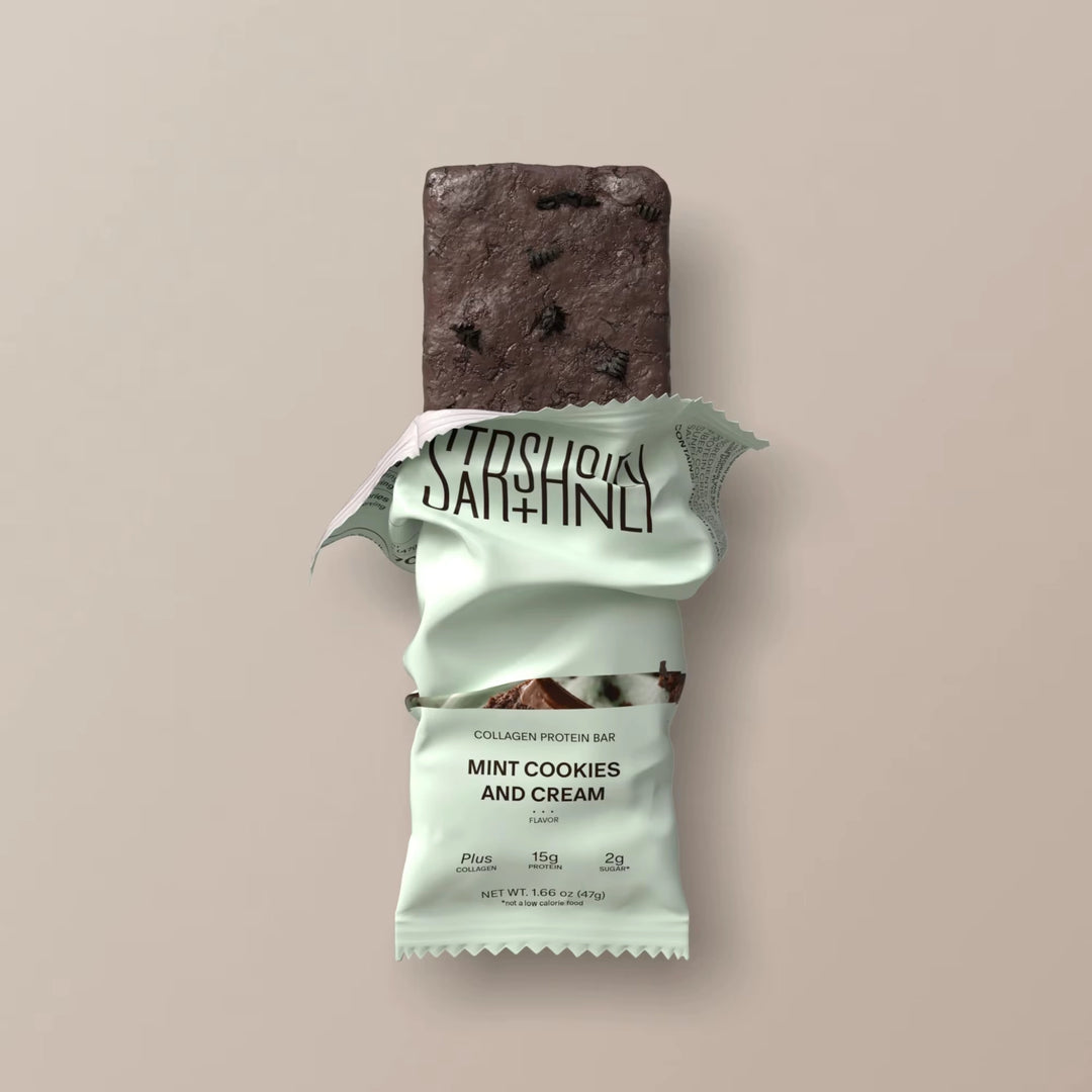 Stars + Honey Mint Cookies and Cream collagen protein bar partially unwrapped