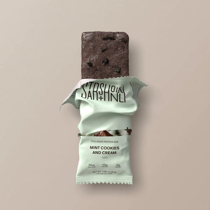 Stars + Honey Mint Cookies and Cream collagen protein bar partially unwrapped