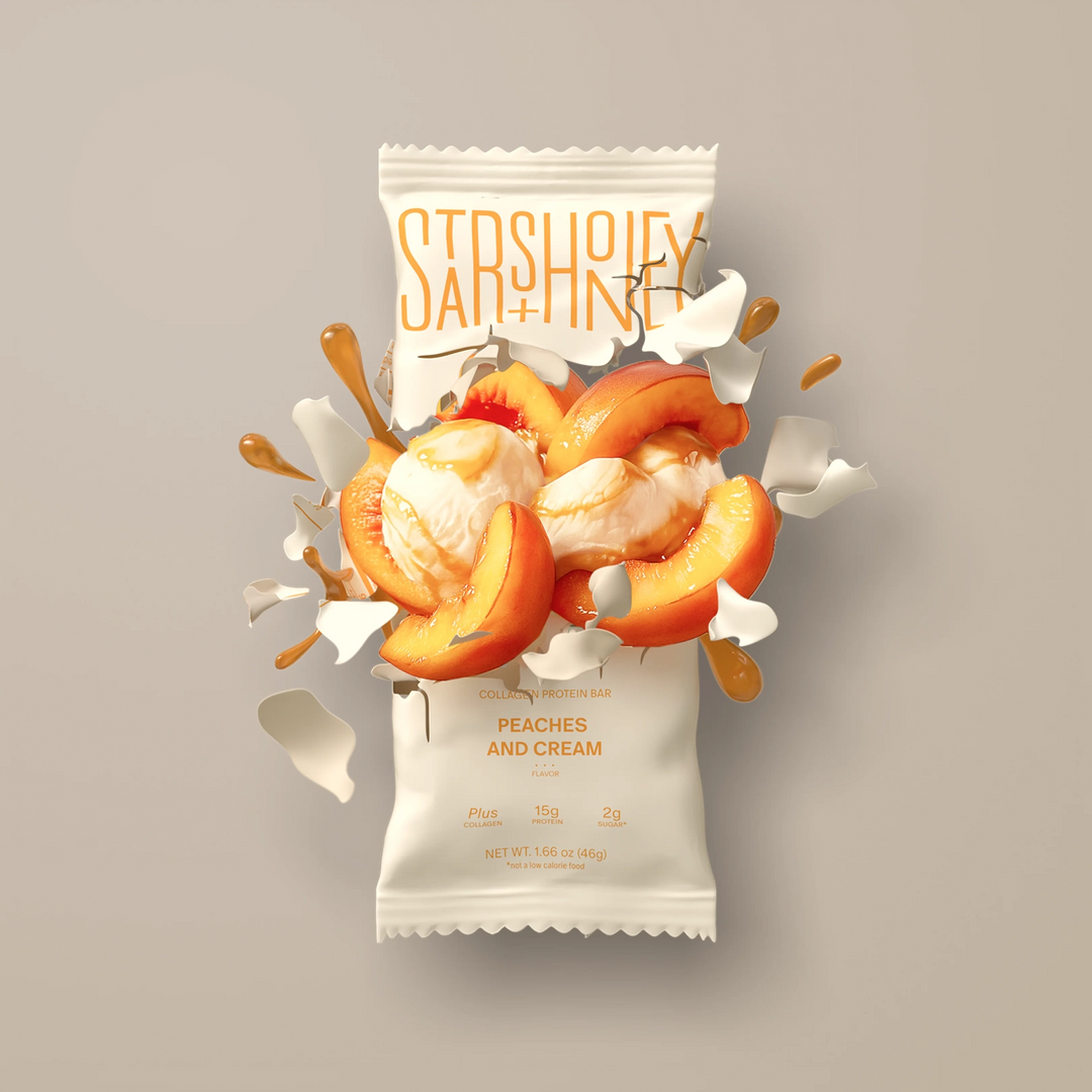 Stars + Honey Peaches and Cream protein bar styled with peaches and vanilla cream